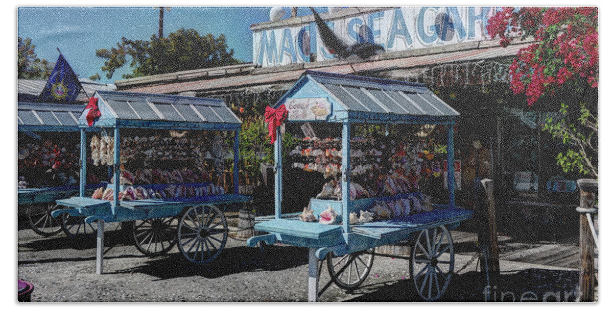 Key Beach Towel featuring the photograph Tourist souvenir shell carts by Ules Barnwell