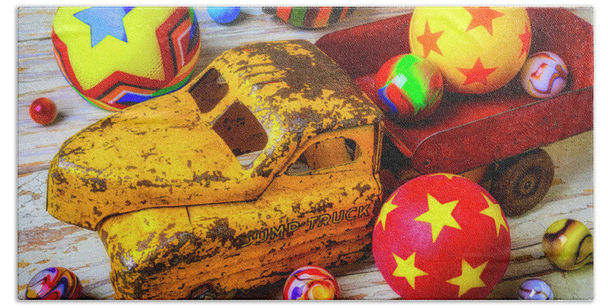 Red Beach Towel featuring the photograph Toy Truck With Balls And Marbles by Garry Gay