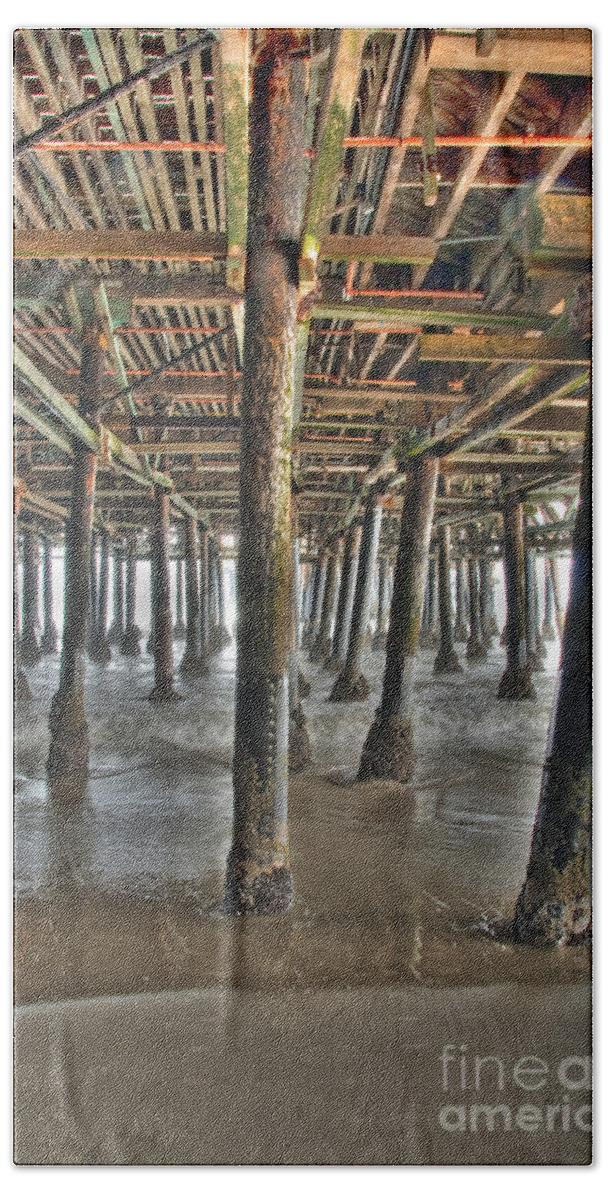 Under The Boardwalk Beach Towel featuring the photograph Under the Boardwalk pier Sunbeams by David Zanzinger