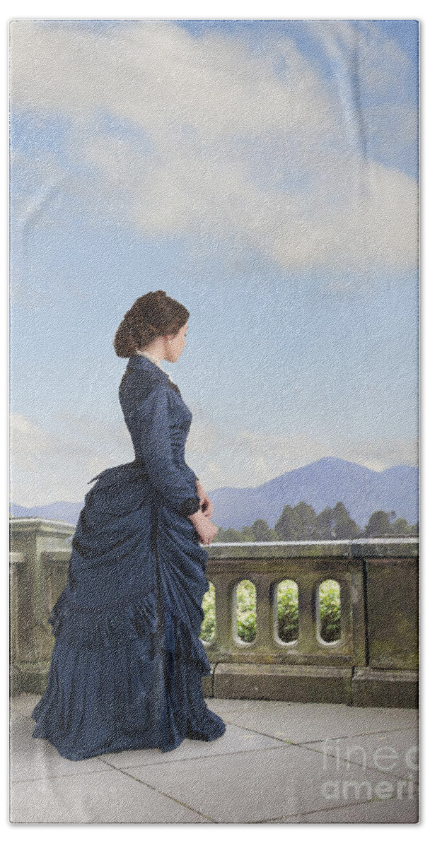 Victorian Beach Towel featuring the photograph Victorian Woman In A Blue Dress Standing On The Terrace by Lee Avison