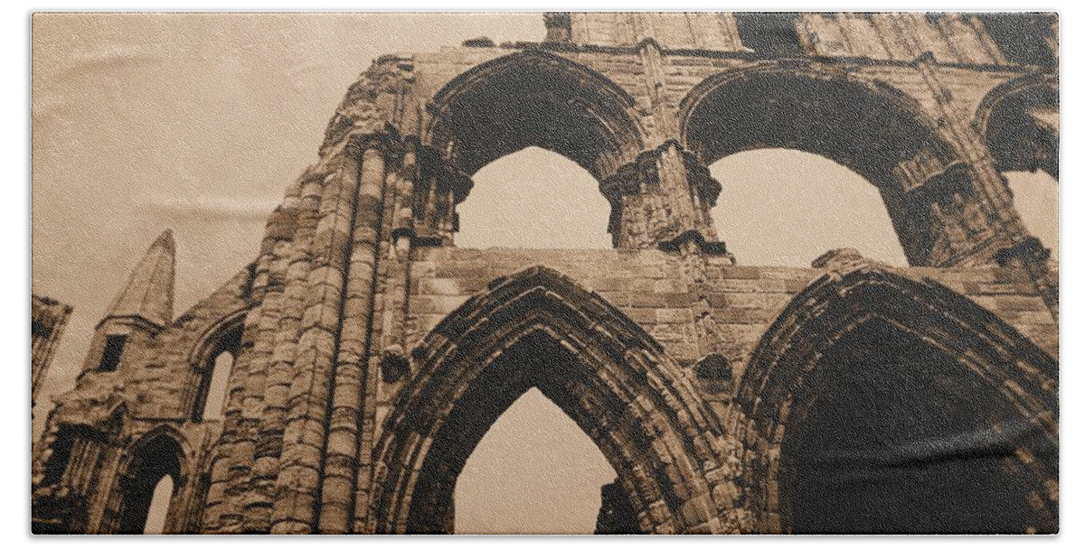 Whitby Abbey England Sepia Old Medieval Middle Ages Church Monastery Nun Nuns Architecture York Yorkshire Monasteries Ruins Saint Century Black Death Building  Cathedral Cloister Feudal Benedictine Monk Monks Celtic Bram Stoker Dracula Beach Towel featuring the photograph Whitby Abbey #73 by Raymond Magnani