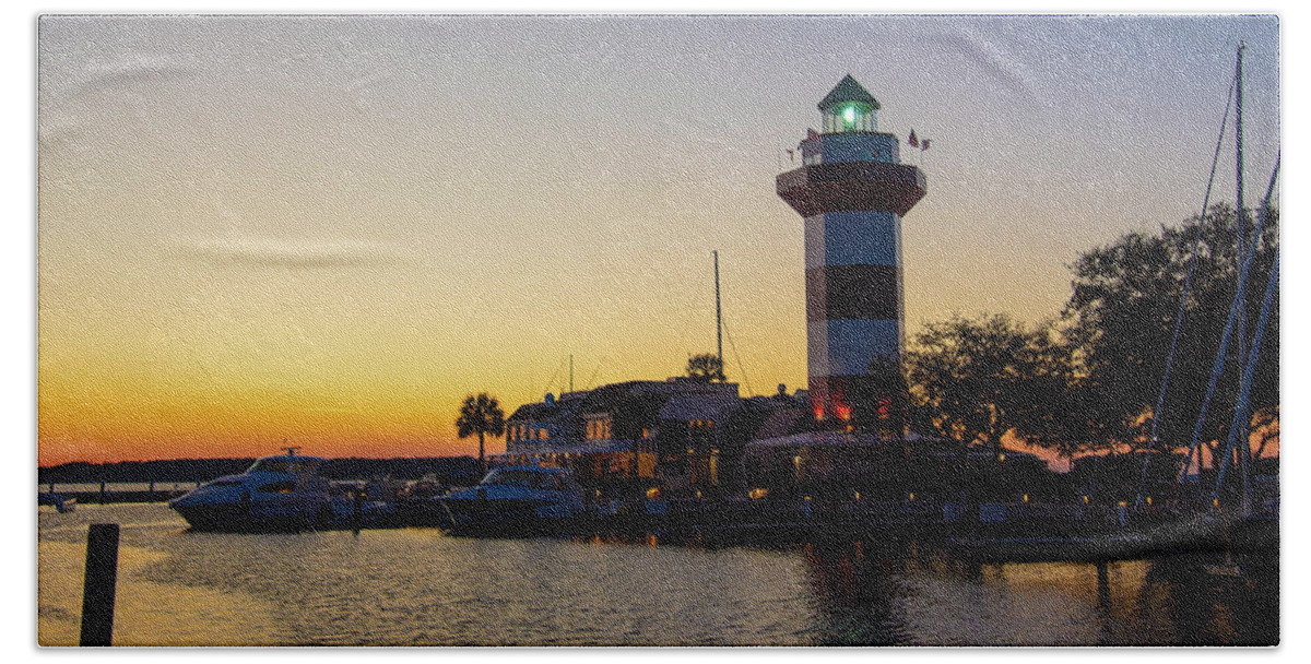 Maritime Beach Towel featuring the photograph Harbour Town Lighthouse At Sunset #1 by Dennis Schmidt