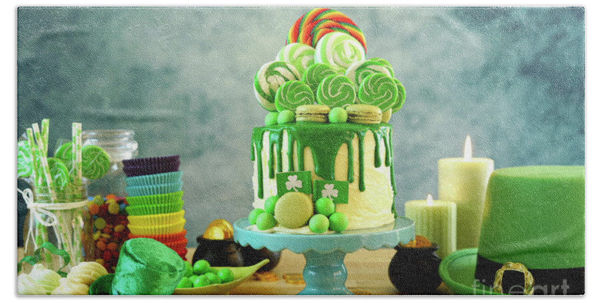 St Patricks Day Beach Towel featuring the photograph St Patrick's Day candyland drip cake and party table. #1 by Milleflore Images