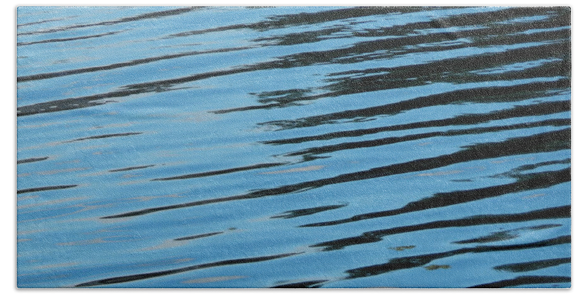 Water Beach Towel featuring the photograph Texture of water ripples on the surface of the river #3 by Oleg Prokopenko