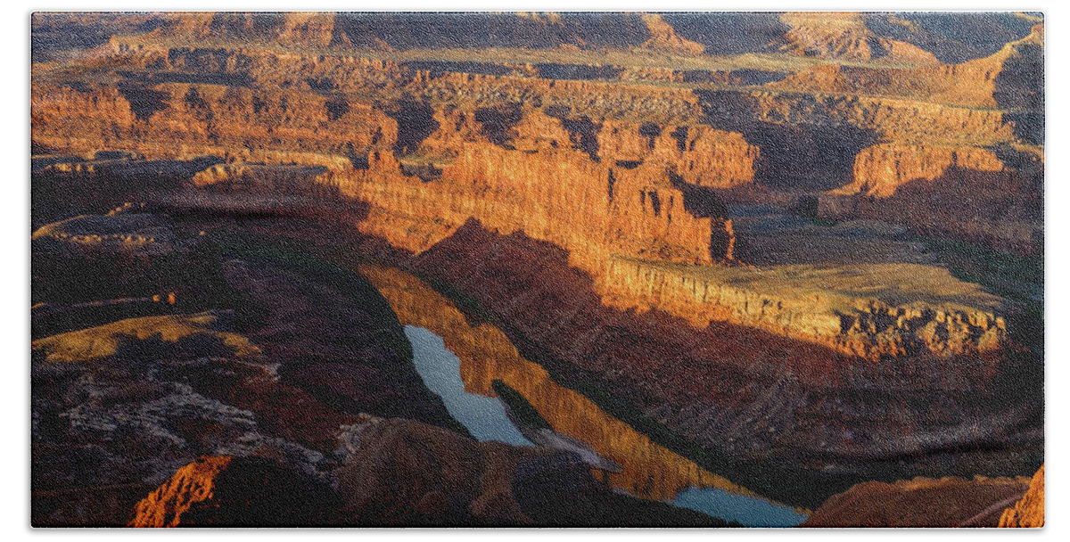 The Almost Full Moon Setting Over The Canyon At Dead Horse Point In Utah As The Sun Rose Lighting Up The Canyon Below. Beach Towel featuring the photograph Canyon Wall Reflection by Johnny Boyd