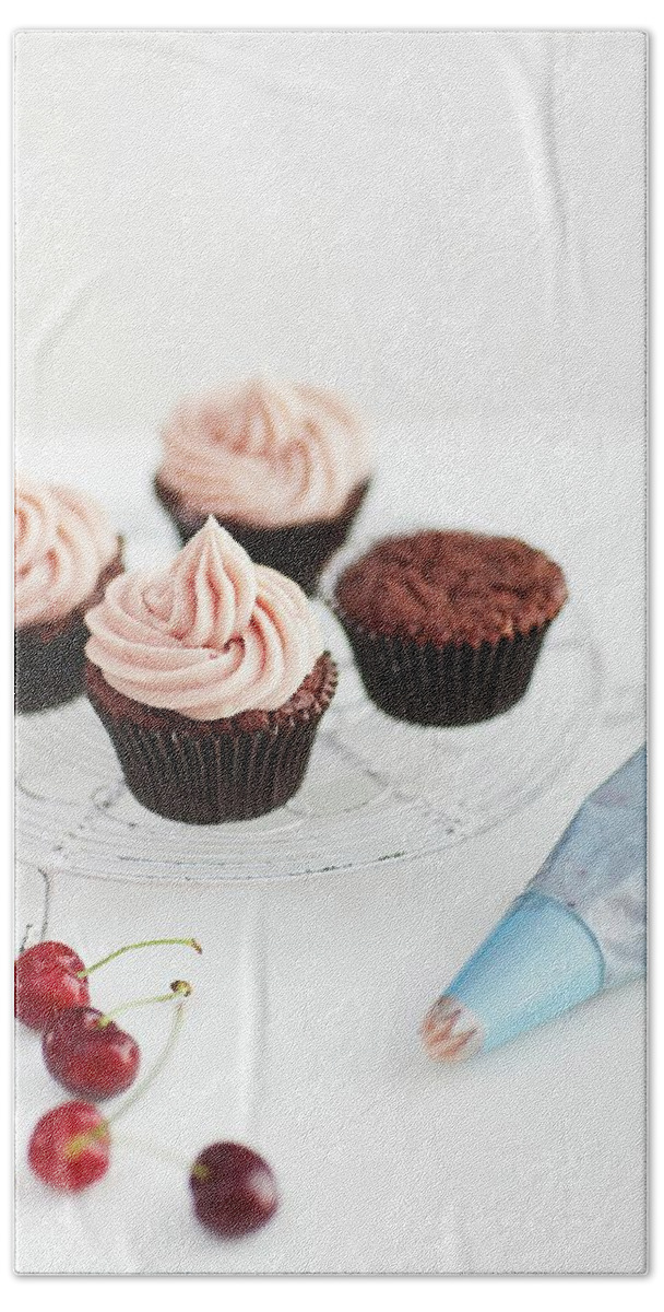 Ip_12238130 Beach Towel featuring the photograph Chocolate Cupcakes With Cherry Icing by Dan Jones