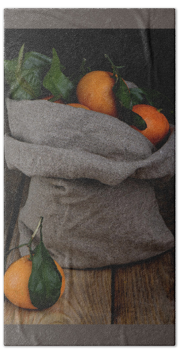 Fresh tangerines in a bag of coarse fabric. Beach Towel by Sergei Dolgov -  Pixels