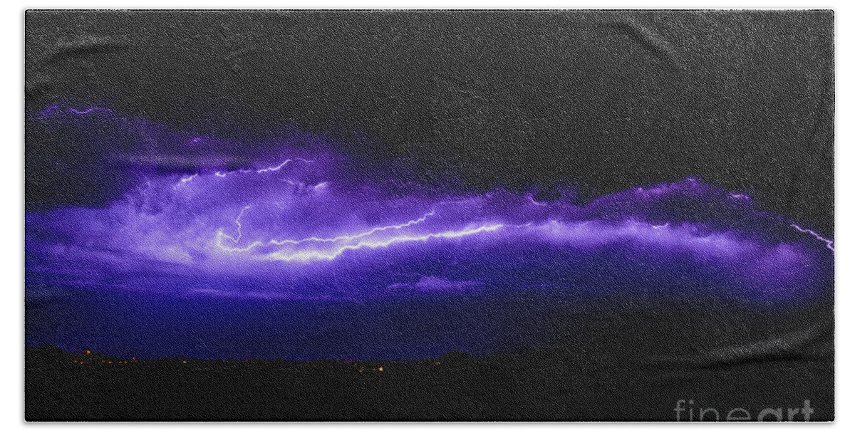Background Beach Towel featuring the photograph Rays in a night storm with light and clouds. by Joaquin Corbalan