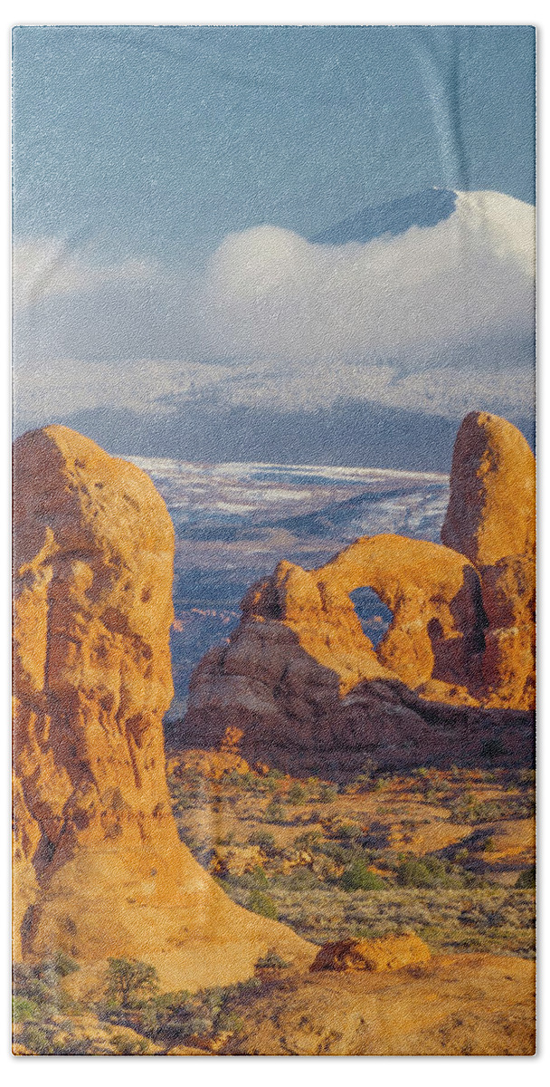Jeff Foott Beach Towel featuring the photograph Turret Arch In Winter by Jeff Foott