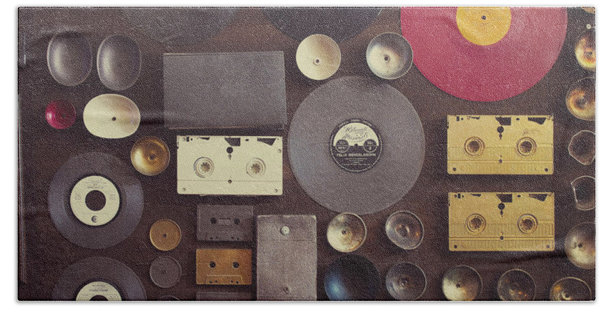 Vintage wall with vinyl records and audio cassettes Photograph by