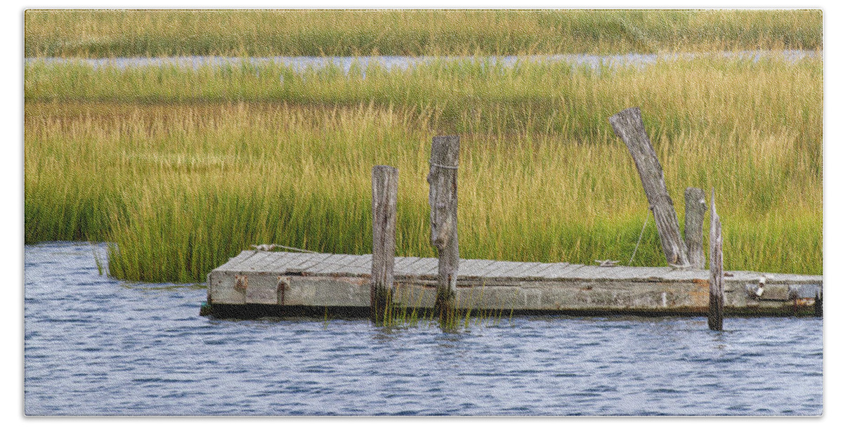 America Beach Towel featuring the photograph Wooden pier in channel of Delaware Bay by Karen Foley