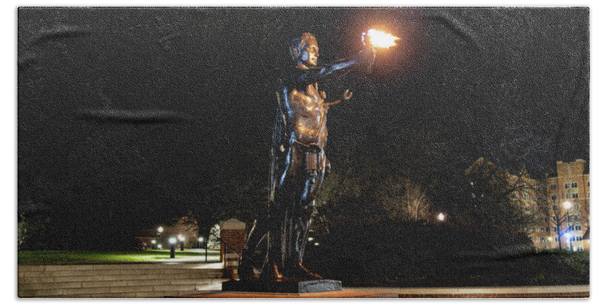 University Of Tennessee At Night Beach Towel featuring the photograph Torchbearer statue at the University of Tennessee at night by Eldon McGraw
