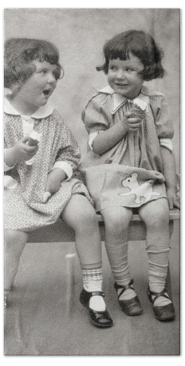 1920s Two Little Girls Sitting On Bench Eating Ice Cream Cones And