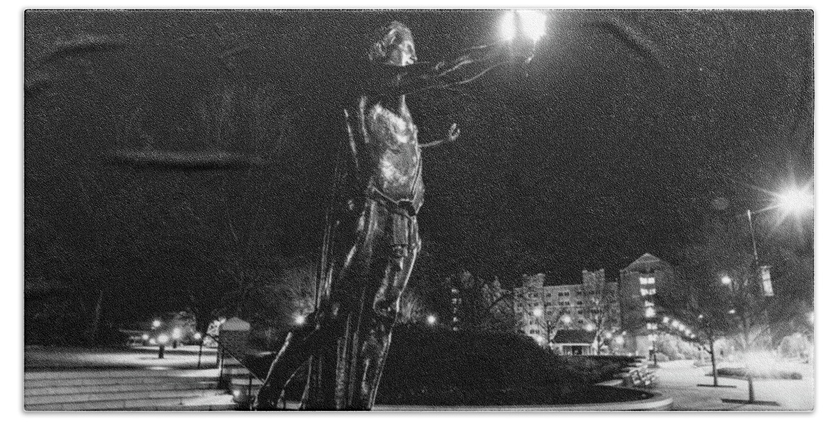 University Of Tennessee At Night Beach Towel featuring the photograph Torchbearer statue at the University of Tennessee at night in black and white #2 by Eldon McGraw