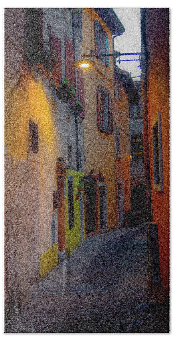 Tourism Beach Towel featuring the photograph A Quiet Stroll in Malcesine by W Chris Fooshee