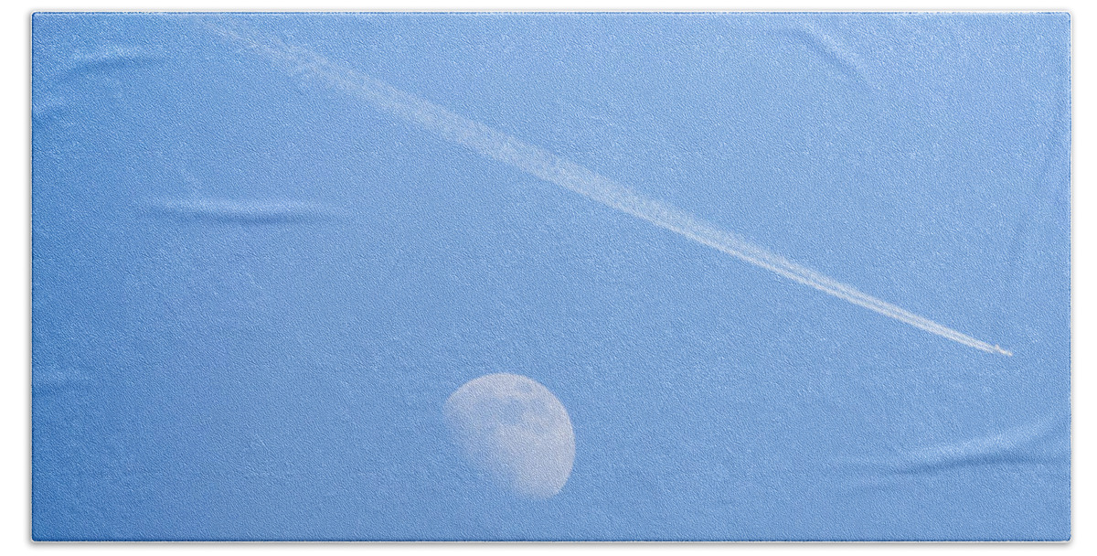 Plane Beach Towel featuring the photograph Aircraft flying over moon leaving vapour trail during the day, S by Ian Middleton