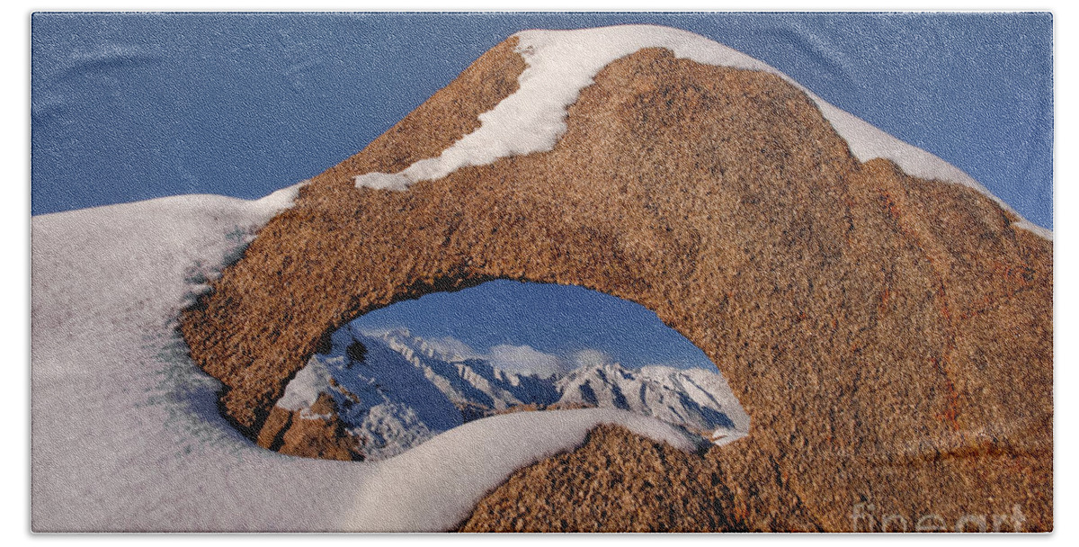 Dave Welling Beach Towel featuring the photograph Arch In Snow Alabama Hills California by Dave Welling