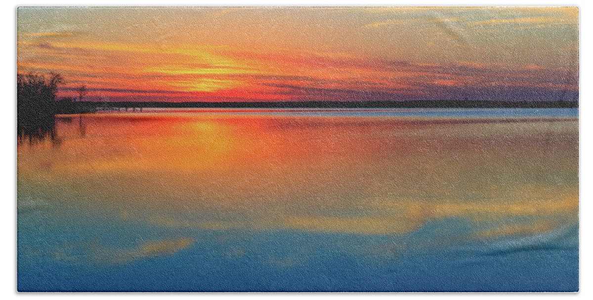 Sunset Beach Towel featuring the photograph Beautiful lake sunset and its reflection. Very calming. by David Ilzhoefer