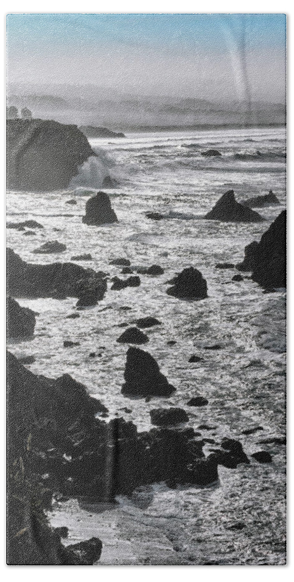 Mendocino Coast Beach Towel featuring the photograph Black and White Seascape Beneath a Pale Blue Sky on the Mendocino Coast by Kathleen Bishop