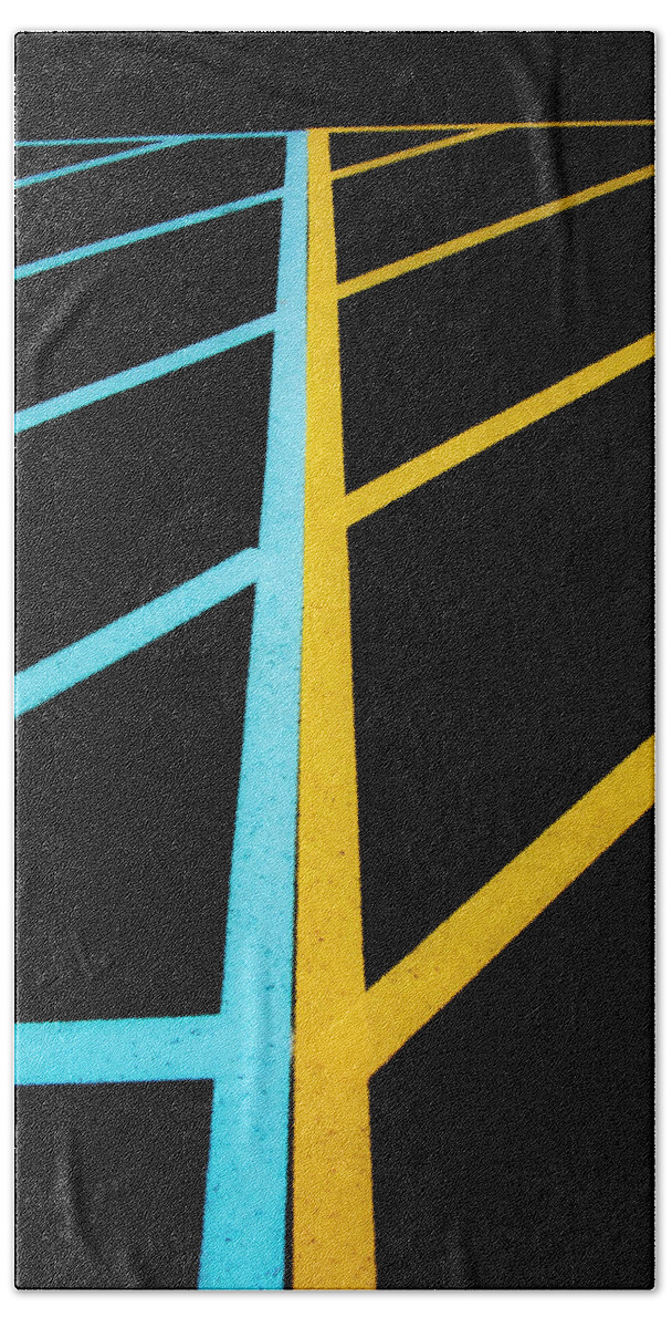 Traffic Lines Beach Towel featuring the photograph Blue And Yellow Traffic Lines Meet Along The Boarder by Gary Slawsky