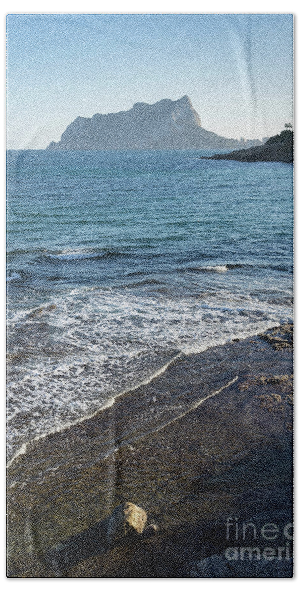 Mediterranean Sea Beach Towel featuring the photograph Blue Mediterranean Sea and the Penon de Ifach in Calpe by Adriana Mueller