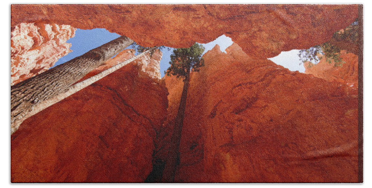 America Beach Towel featuring the photograph Blue sky piercing between two orange cliffs by Jean-Luc Farges