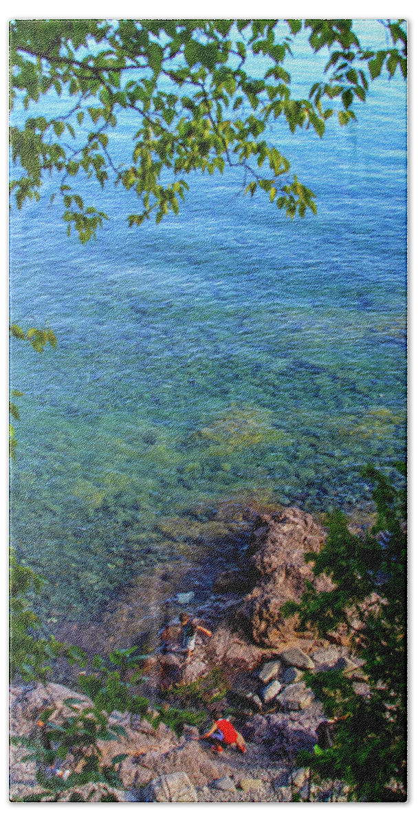 Bonnie Follett Beach Towel featuring the photograph Boys playing on shore rocks by Bonnie Follett