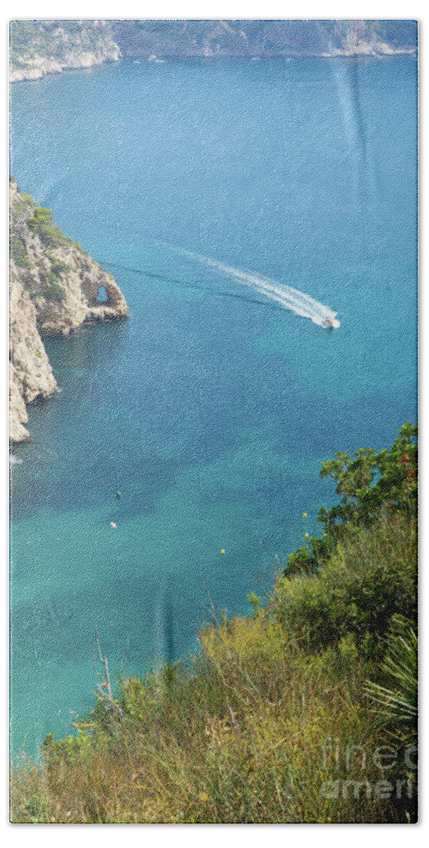 Mediterranean Sea Beach Towel featuring the photograph Seawater and motor boat. Cala de la Granadella by Adriana Mueller