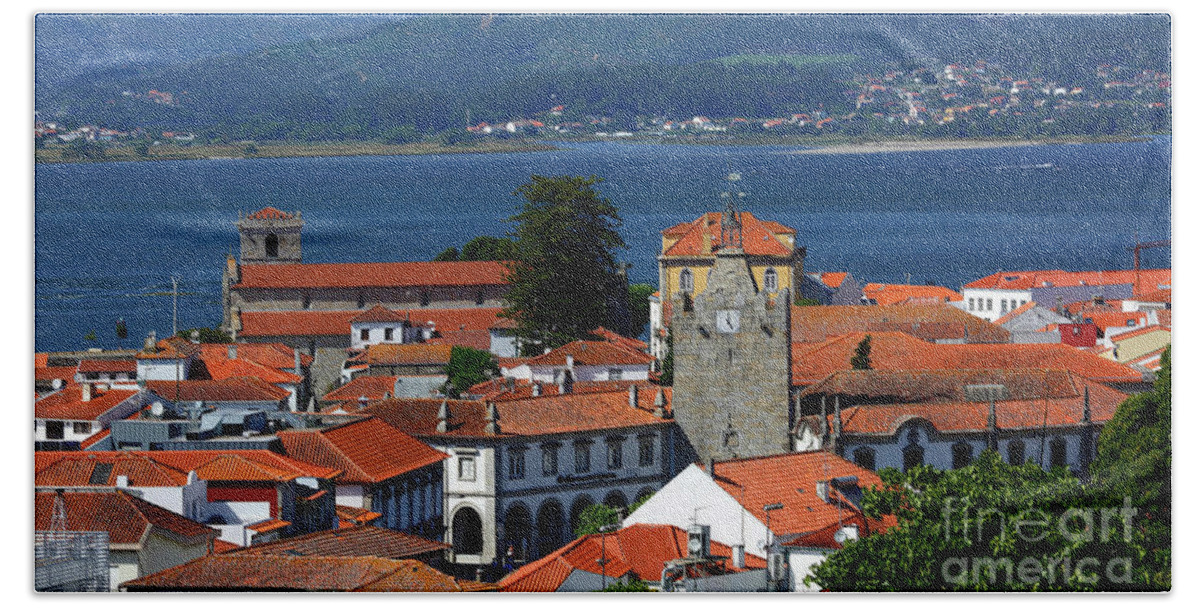 Portugal Beach Towel featuring the photograph Caminha Old Town rooftops and towers Portugal by James Brunker