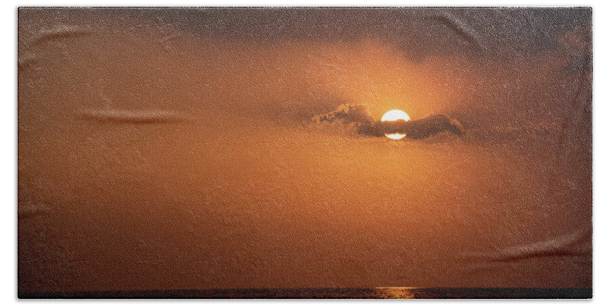 Bright Light Beach Towel featuring the photograph Dramatic sunset over the ocean. Cloudy and orange sky. Beautiful end of day by Michalakis Ppalis