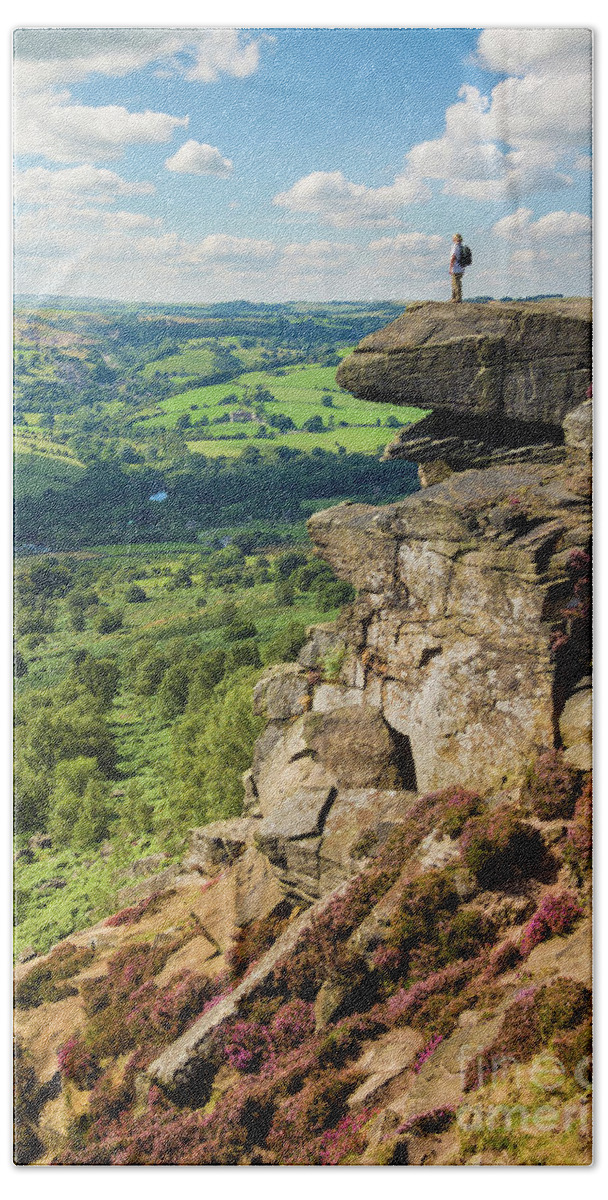 Derbyshire Beach Towel featuring the photograph Hiker standing alone on Froggatt Edge, Derbyshire Peak District National Park, England by Neale And Judith Clark