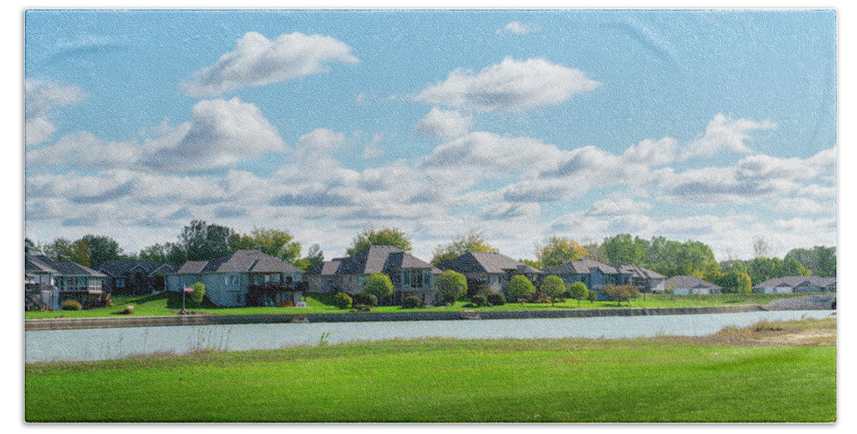 Clouds Beach Towel featuring the photograph House And Lake Lined Fairway by Ed Peterson