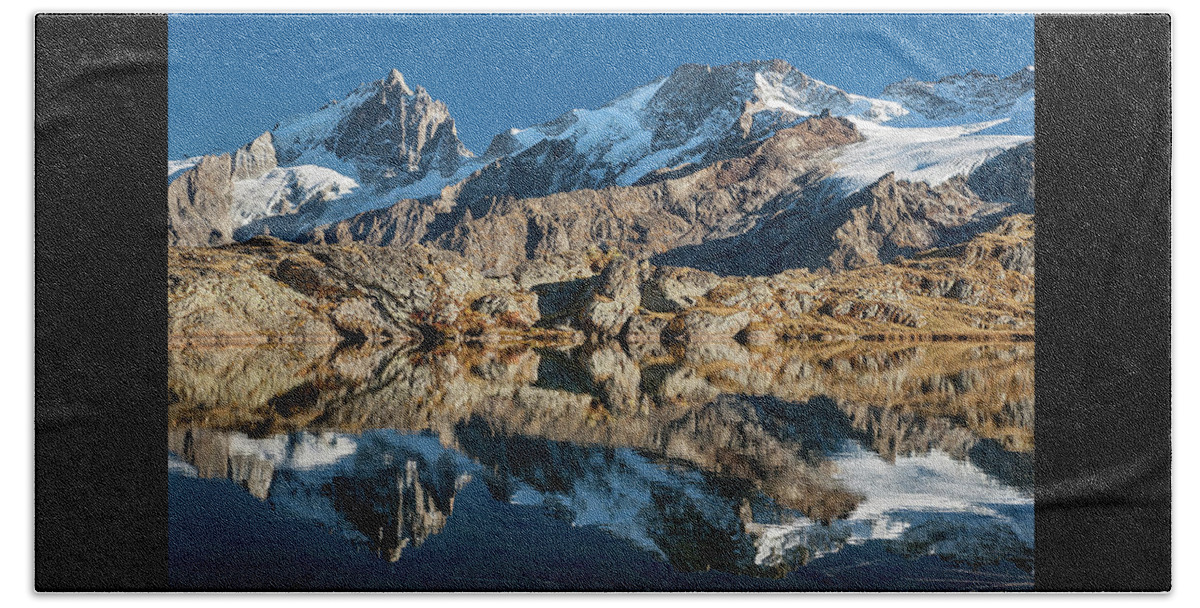 Lake Beach Towel featuring the photograph La Meije peak mirrored in Lake Lerie by Olivier Parent