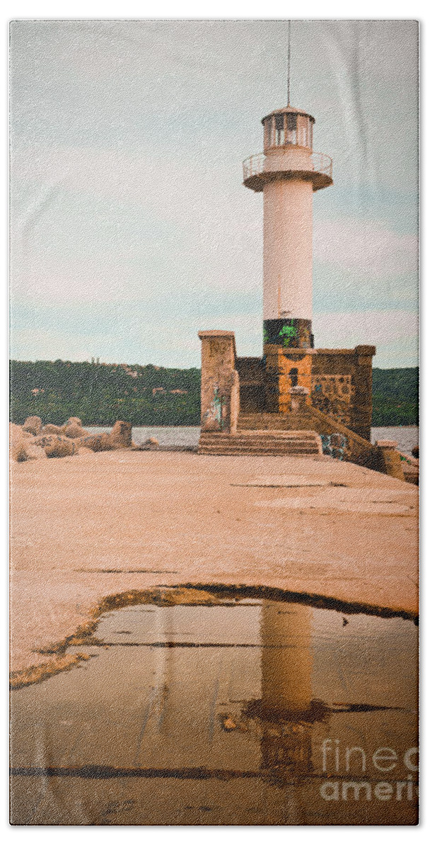 Lighthouse Beach Towel featuring the photograph Lighthouse in the water at cloudy sunset by Yavor Mihaylov
