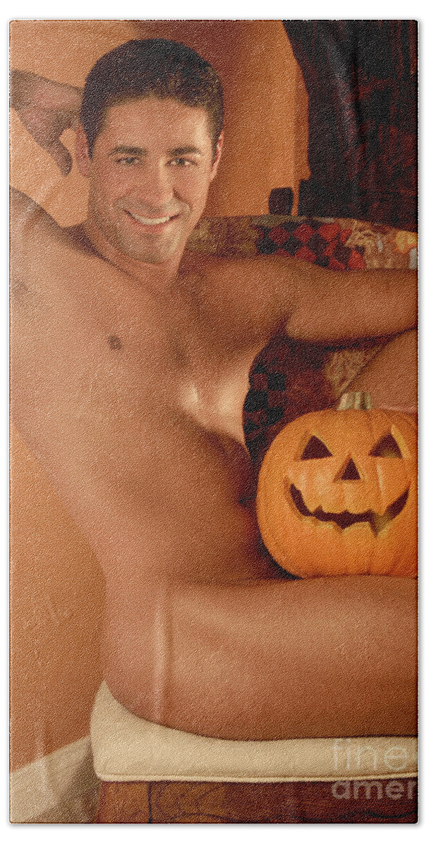 Young Beach Towel featuring the photograph Male nude with Halloween Pumpkin by Gunther Allen