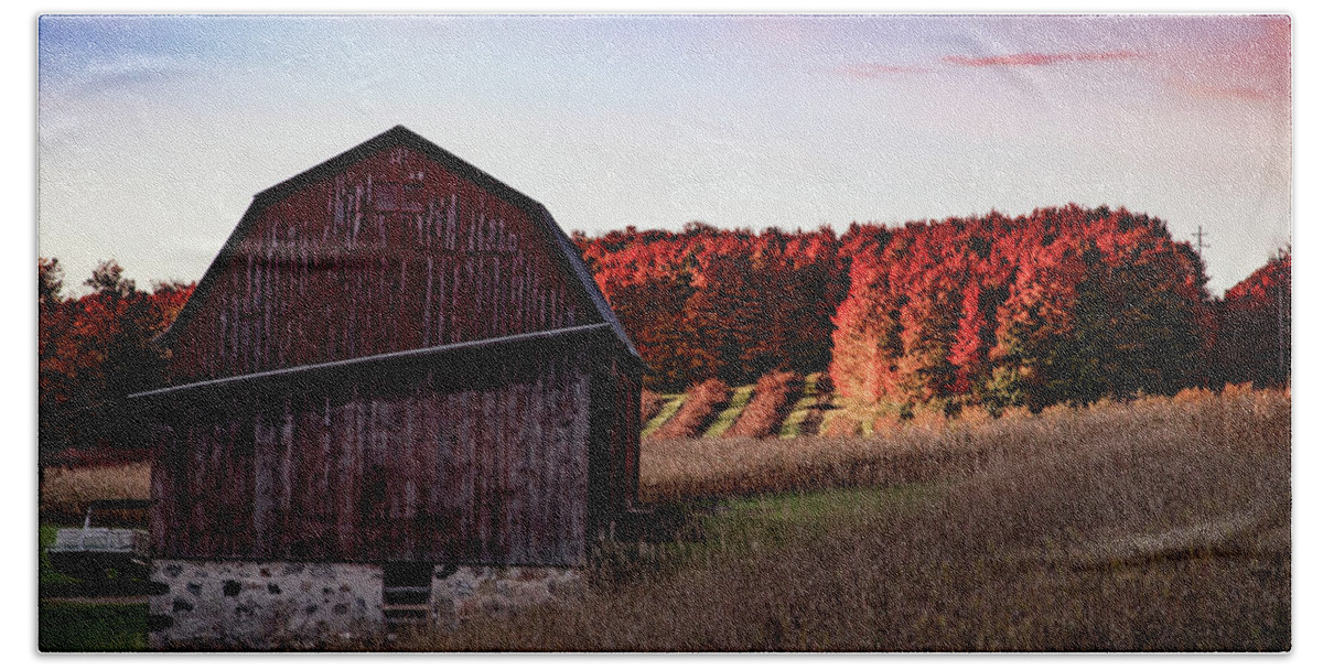 Michigan Fall Beach Towel featuring the photograph Red barn at sunrise with fall colors in northern Michigan by Eldon McGraw