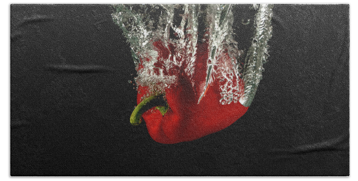 Pepper Beach Towel featuring the photograph Red bell pepper dropped and slashing on water by Michalakis Ppalis