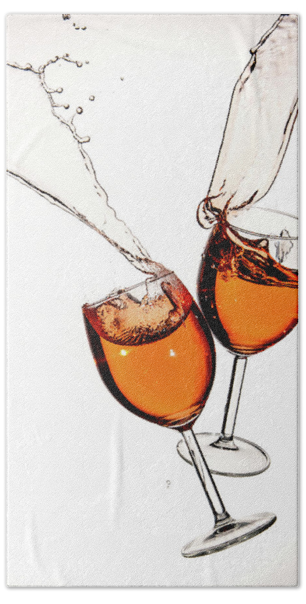 Alcohol Beach Towel featuring the photograph Red wine in glasses with splashes on a white background isolated by Michalakis Ppalis