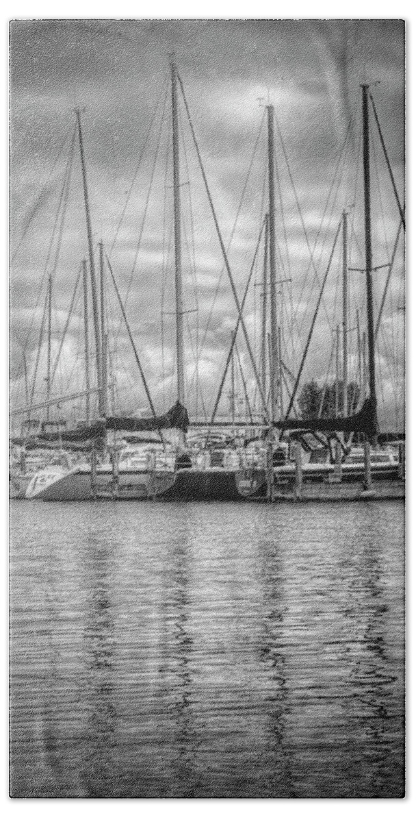 Boats Beach Towel featuring the photograph Reflections and Boats at the Harbor in Black and White by Debra and Dave Vanderlaan