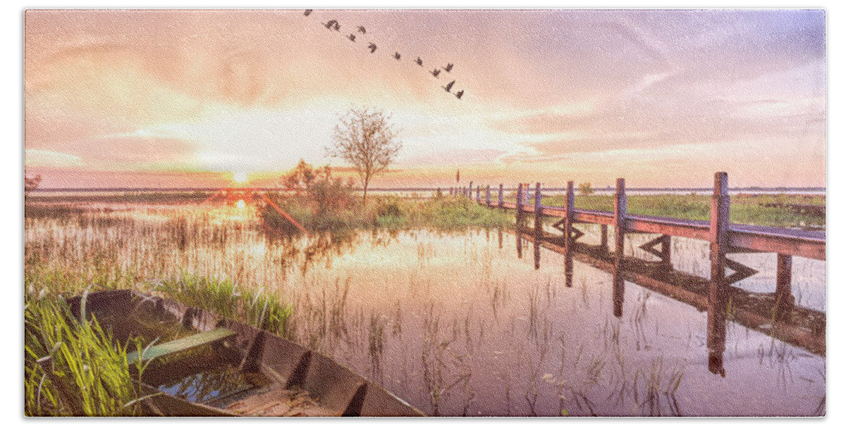 Birds Beach Towel featuring the photograph Rowboat in the Marsh in Soft Light at Sunset by Debra and Dave Vanderlaan