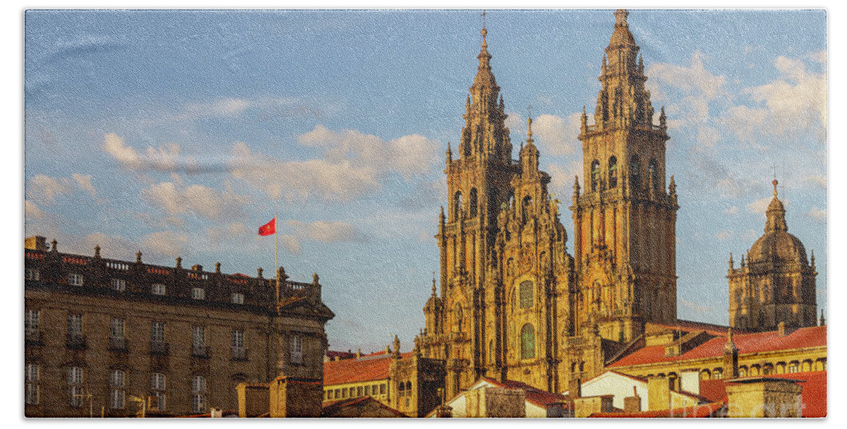 Way Beach Towel featuring the photograph Santiago de Compostela Cathedral Towers Close Up with Sun Light Hitting the facade and Tiled Roofs La Corua Galicia by Pablo Avanzini