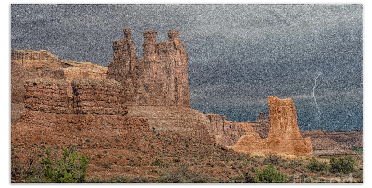 Southwest Beach Towel featuring the photograph Storm Over Arches National Park by Sandra Bronstein