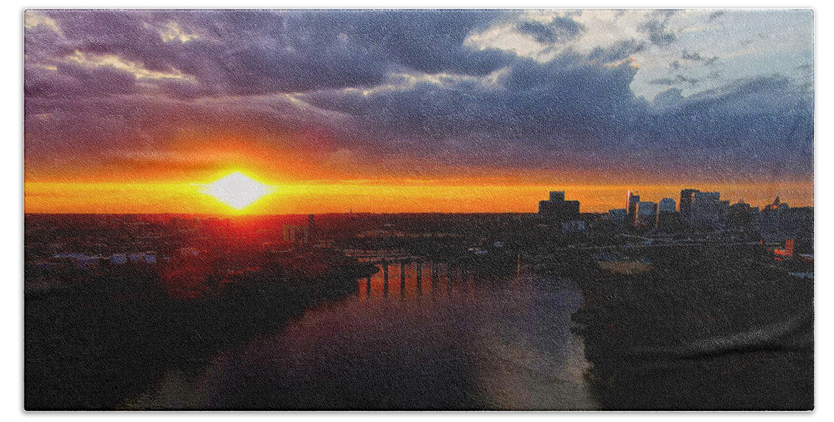  Beach Towel featuring the photograph Sunset over the James and city by Stephen Dorton