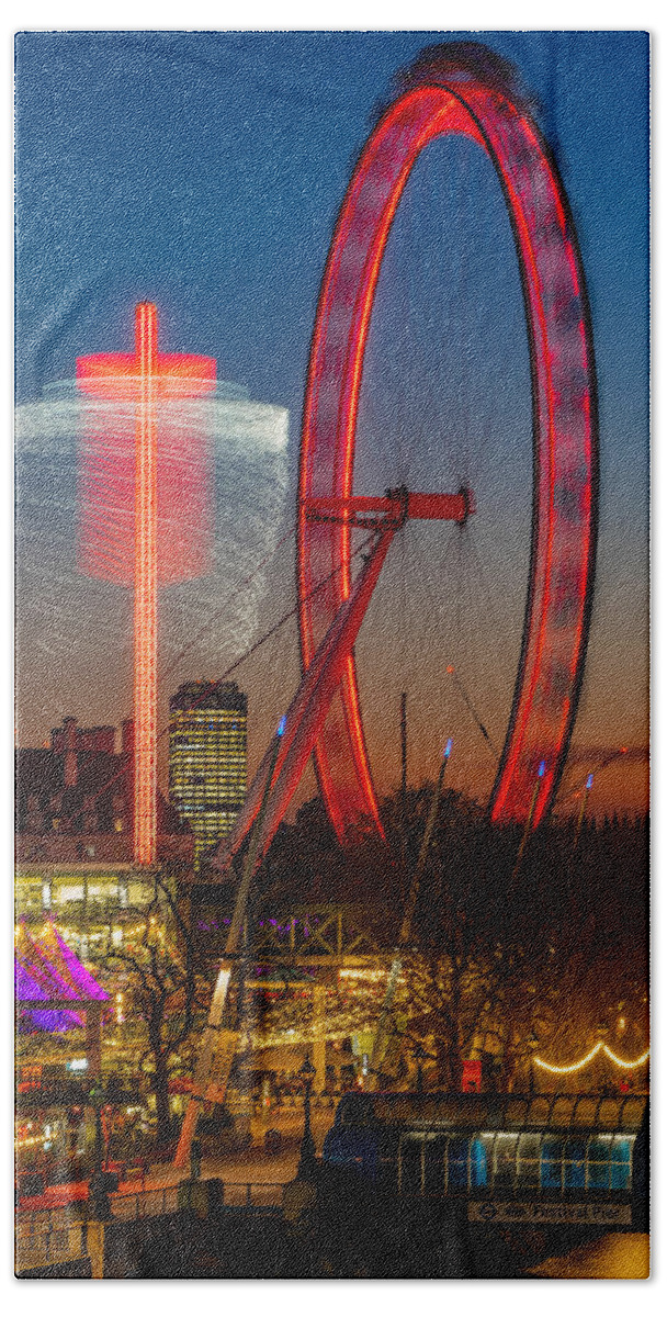 London Beach Towel featuring the photograph The beautiful London eye seen at blue hour. by George Afostovremea
