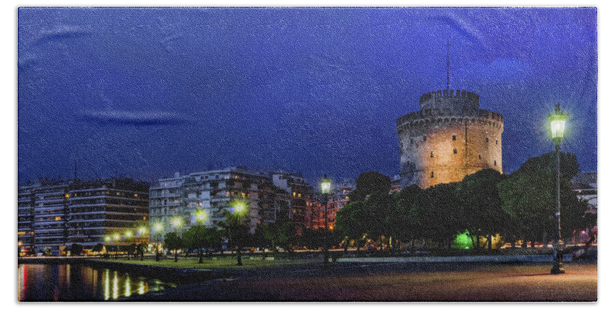 White Tower Beach Towel featuring the photograph The White Tower of Thessaloniki night view by Alexios Ntounas