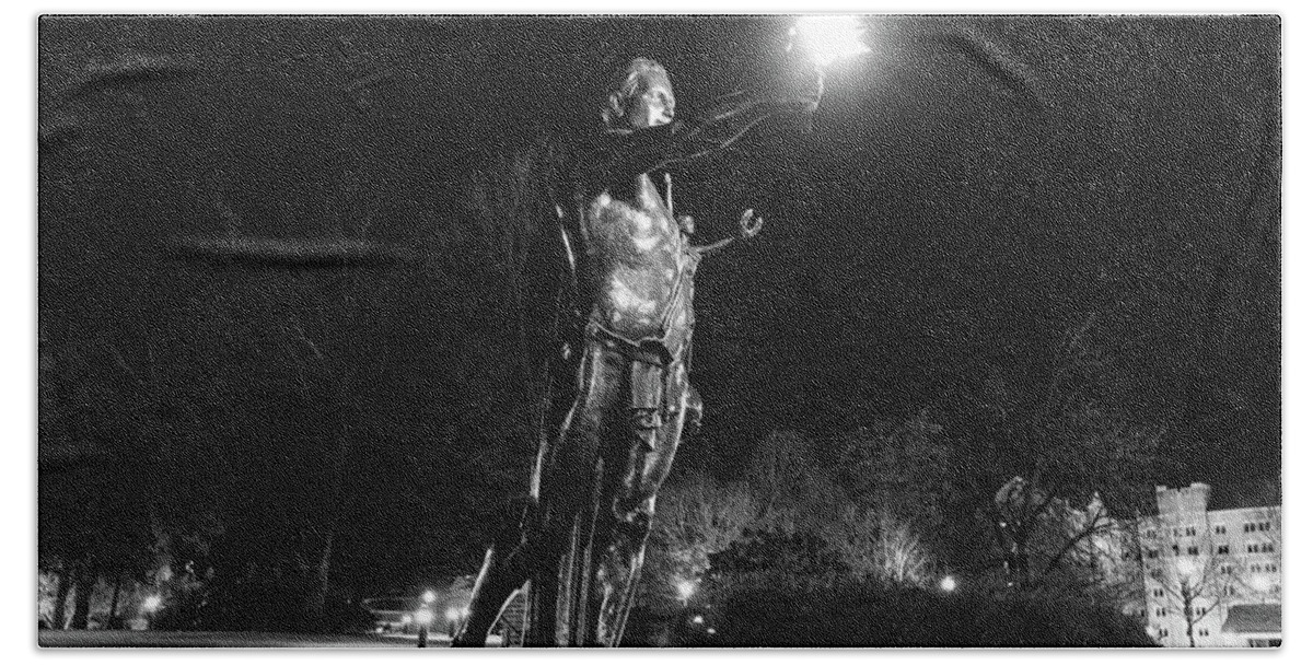 University Of Tennessee At Night Beach Towel featuring the photograph Torchbearer statue at the University of Tennessee at night in black and white by Eldon McGraw