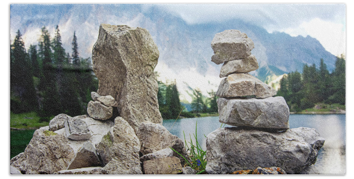 Two Beach Towel featuring the photograph Two stone towers as route markers. by Bernhard Schaffer