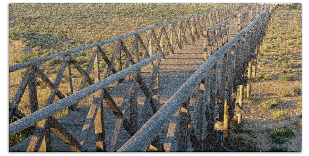 Quinta Do Lago Beach Towel featuring the photograph View of the wooden bridge in Quinta do Lago by Angelo DeVal