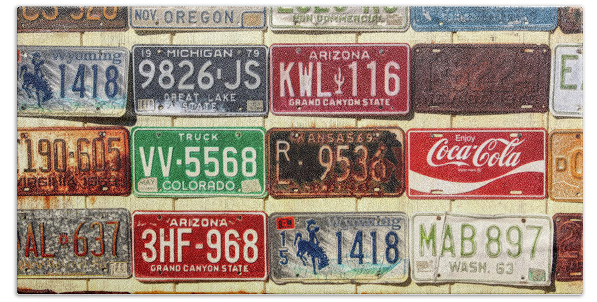 Antique Beach Towel featuring the photograph Vintage license plates display by Tatiana Travelways