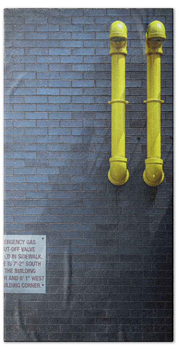 Yellow Pipes Beach Towel featuring the photograph yellow pipes - Queens, NY by Steve Stanger